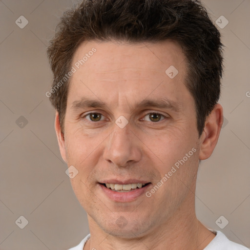 Joyful white adult male with short  brown hair and brown eyes