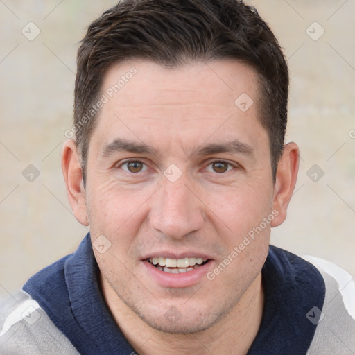 Joyful white adult male with short  brown hair and brown eyes