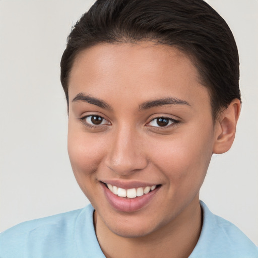 Joyful white young-adult female with short  brown hair and brown eyes