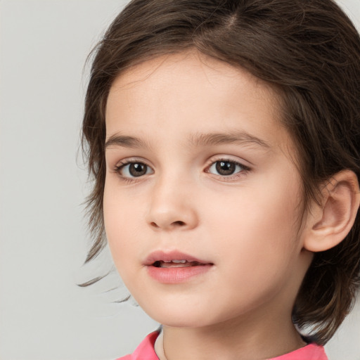 Joyful white child female with medium  brown hair and brown eyes