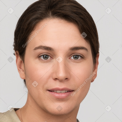 Joyful white young-adult female with short  brown hair and grey eyes