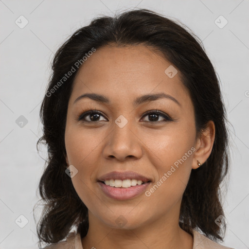 Joyful latino young-adult female with medium  brown hair and brown eyes