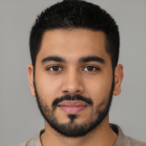 Neutral latino young-adult male with short  black hair and brown eyes