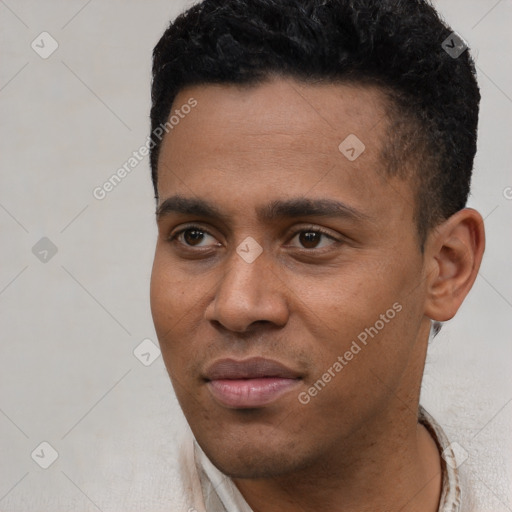 Joyful latino young-adult male with short  black hair and brown eyes