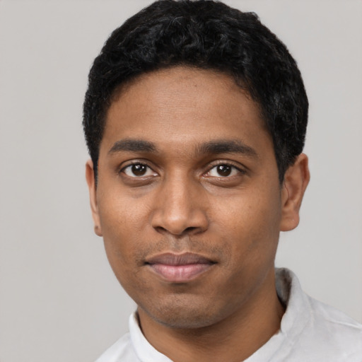 Neutral black young-adult male with short  black hair and brown eyes