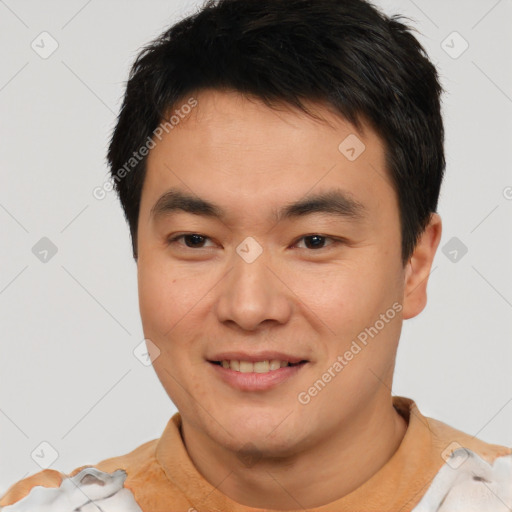 Joyful asian young-adult male with short  brown hair and brown eyes