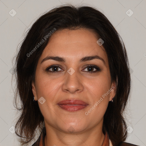 Joyful white adult female with medium  brown hair and brown eyes