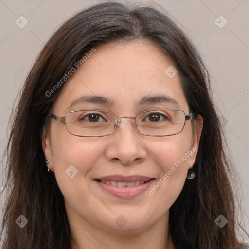 Joyful white adult female with long  brown hair and brown eyes