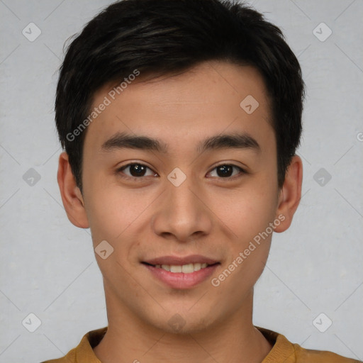 Joyful asian young-adult male with short  brown hair and brown eyes