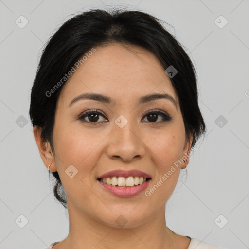 Joyful asian young-adult female with medium  black hair and brown eyes