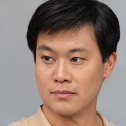 Neutral asian young-adult male with short  brown hair and brown eyes