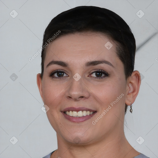 Joyful white young-adult female with short  black hair and brown eyes