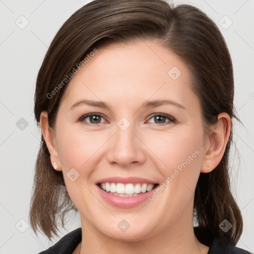 Joyful white young-adult female with medium  brown hair and grey eyes