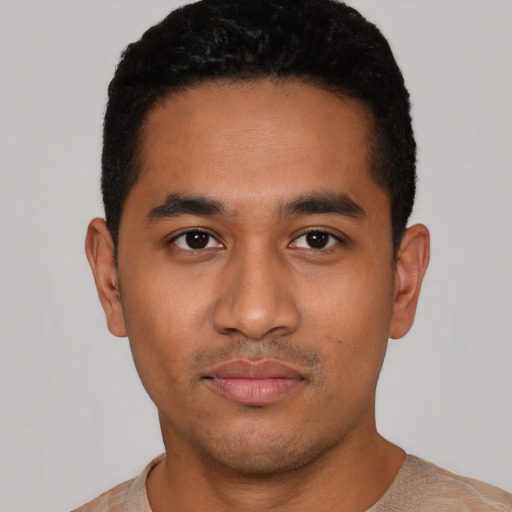 Neutral latino young-adult male with short  black hair and brown eyes