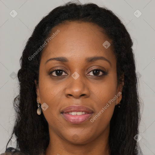 Joyful black young-adult female with long  brown hair and brown eyes