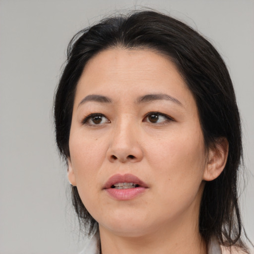 Neutral asian adult female with medium  black hair and brown eyes