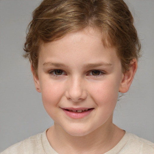 Joyful white child female with short  brown hair and brown eyes