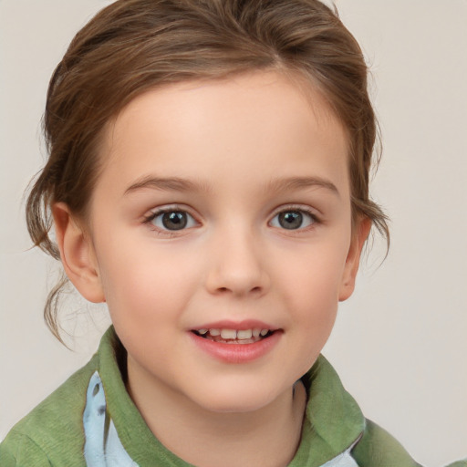 Joyful white child female with short  brown hair and brown eyes