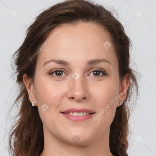 Joyful white young-adult female with long  brown hair and grey eyes