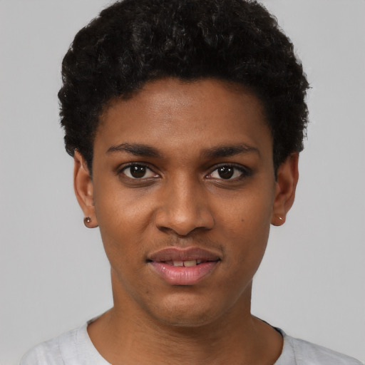 Joyful black young-adult female with short  black hair and brown eyes