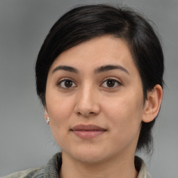 Joyful white young-adult female with medium  brown hair and brown eyes