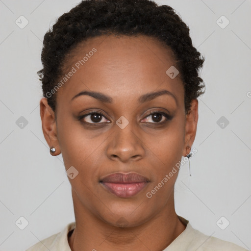 Joyful black young-adult female with short  black hair and brown eyes