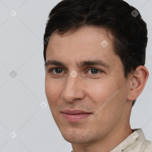 Joyful white adult male with short  brown hair and brown eyes