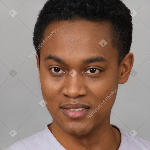 Joyful black young-adult male with short  black hair and brown eyes