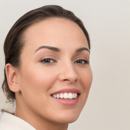 Joyful white young-adult female with medium  brown hair and brown eyes