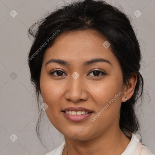 Joyful latino young-adult female with medium  brown hair and brown eyes