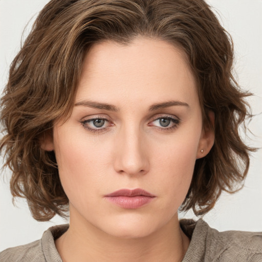 Neutral white young-adult female with medium  brown hair and green eyes