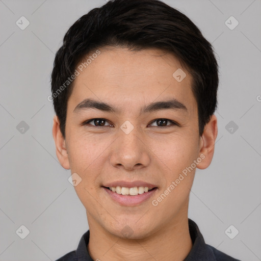 Joyful asian young-adult male with short  black hair and brown eyes