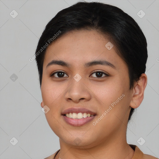 Joyful asian young-adult female with short  brown hair and brown eyes