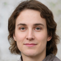 Joyful white young-adult female with medium  brown hair and green eyes