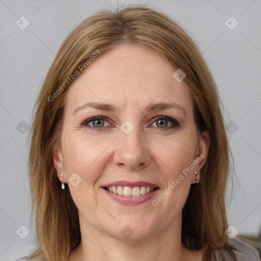 Joyful white adult female with medium  brown hair and grey eyes