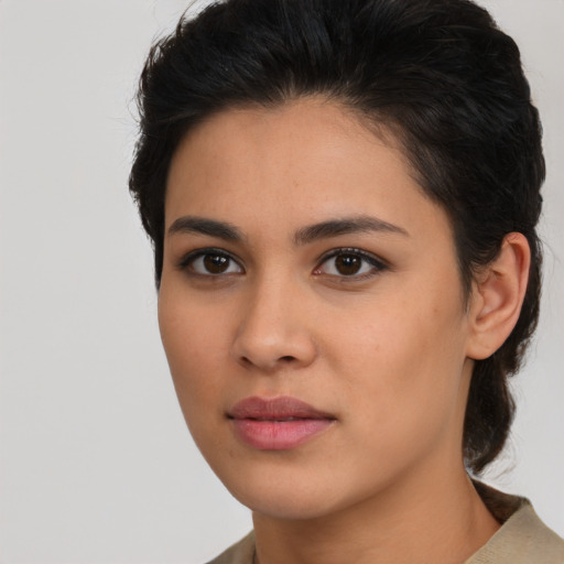 Neutral latino young-adult female with medium  brown hair and brown eyes