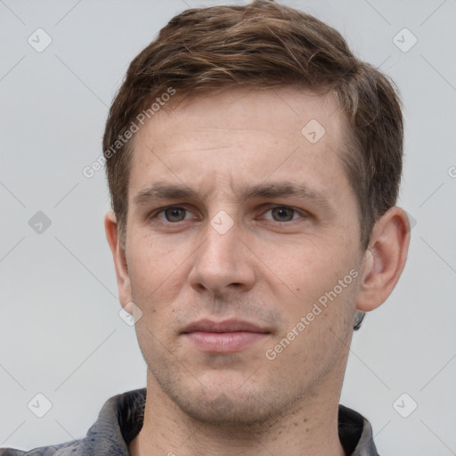 Neutral white young-adult male with short  brown hair and grey eyes