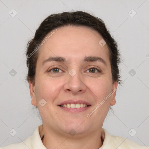 Joyful white adult female with short  brown hair and brown eyes