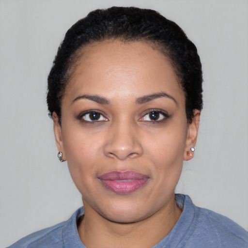 Joyful white young-adult female with short  black hair and brown eyes
