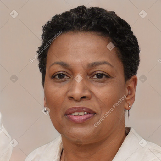 Joyful black adult female with short  brown hair and brown eyes