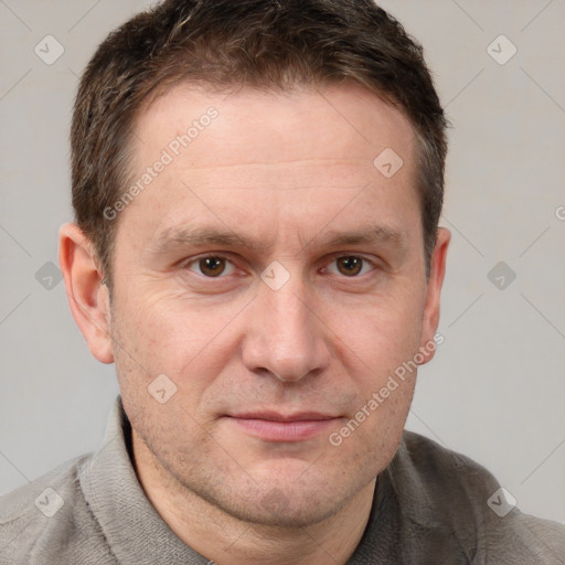 Joyful white adult male with short  brown hair and grey eyes