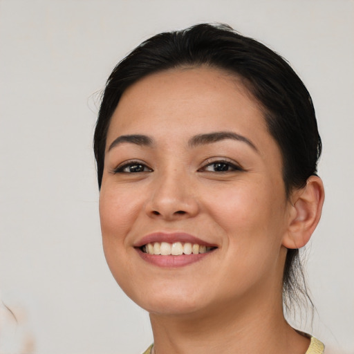 Joyful asian young-adult female with medium  black hair and brown eyes