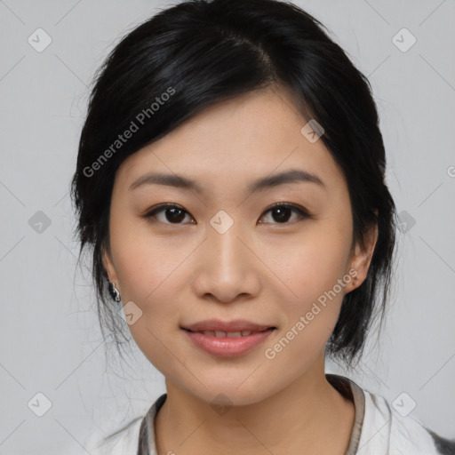 Joyful asian young-adult female with medium  black hair and brown eyes