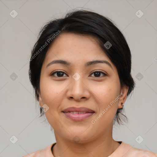 Joyful latino young-adult female with medium  brown hair and brown eyes