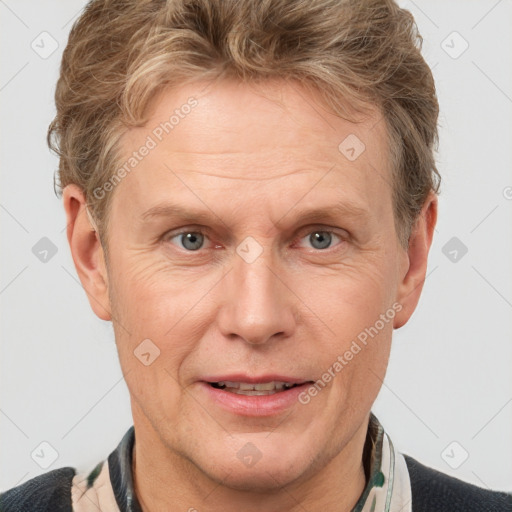 Joyful white adult male with short  brown hair and grey eyes