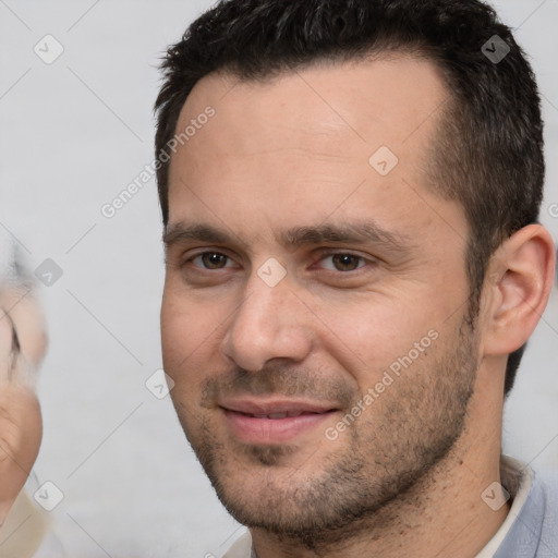 Joyful white adult male with short  brown hair and brown eyes