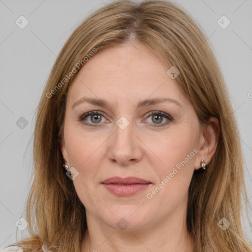 Joyful white adult female with long  brown hair and brown eyes