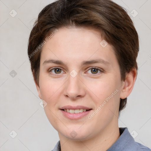 Joyful white young-adult female with short  brown hair and grey eyes