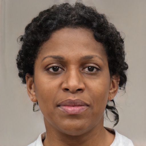 Neutral black young-adult female with short  brown hair and brown eyes