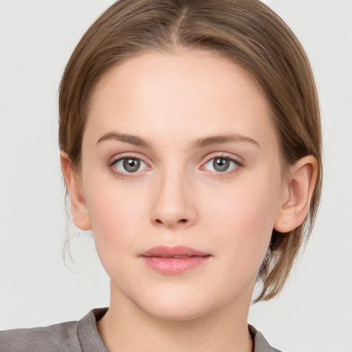 Neutral white young-adult female with medium  brown hair and grey eyes